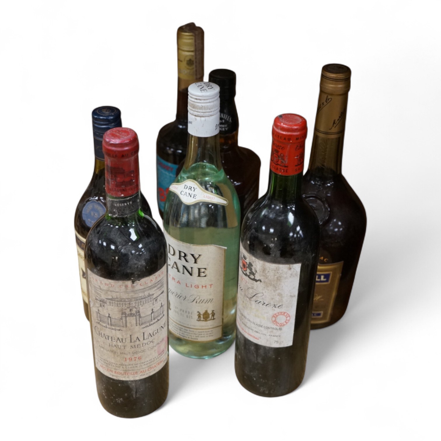 Two bottles of claret and five bottles of spirits to include Dry Cane Rum and Martel Cognac